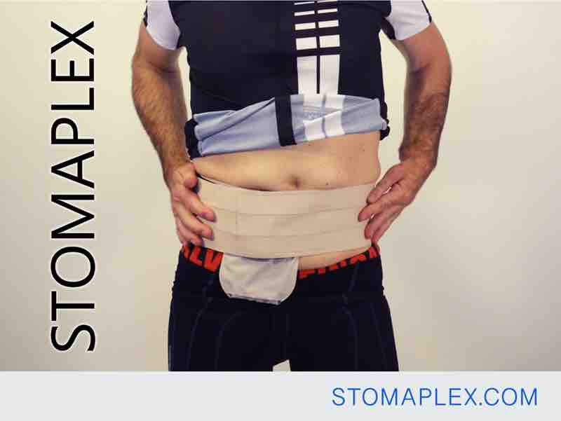 Stomaplex ostomy henia belt on man who is getting ready to ride a bike outside, Microfiber Ostomy Support Belts
